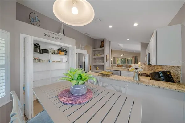 a lobby with furniture and a potted plant
