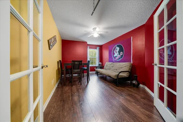 a bedroom with furniture and a wooden floor