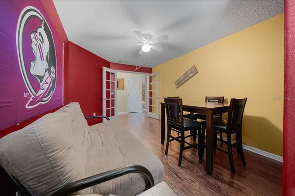 a view of a dining room with furniture and wooden floor
