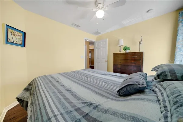 a bedroom with bed and a window