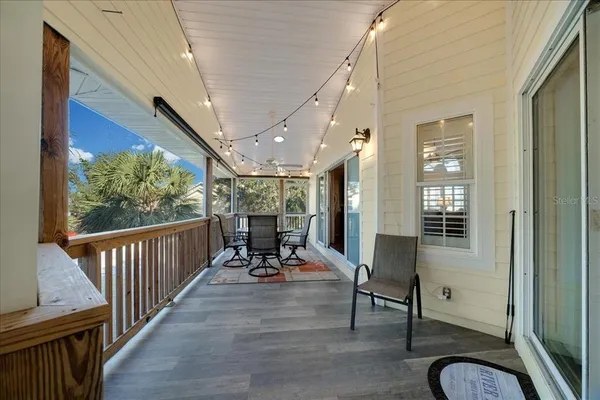 a view of a patio with table and chairs