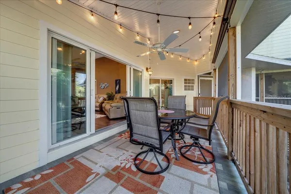 a view of a balcony with wooden floor and outdoor space