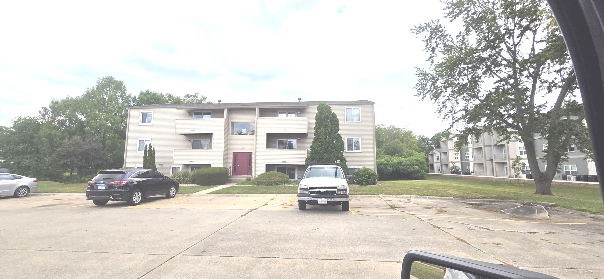 a view of a street with a building in the background