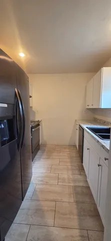 a view of a kitchen with cabinets