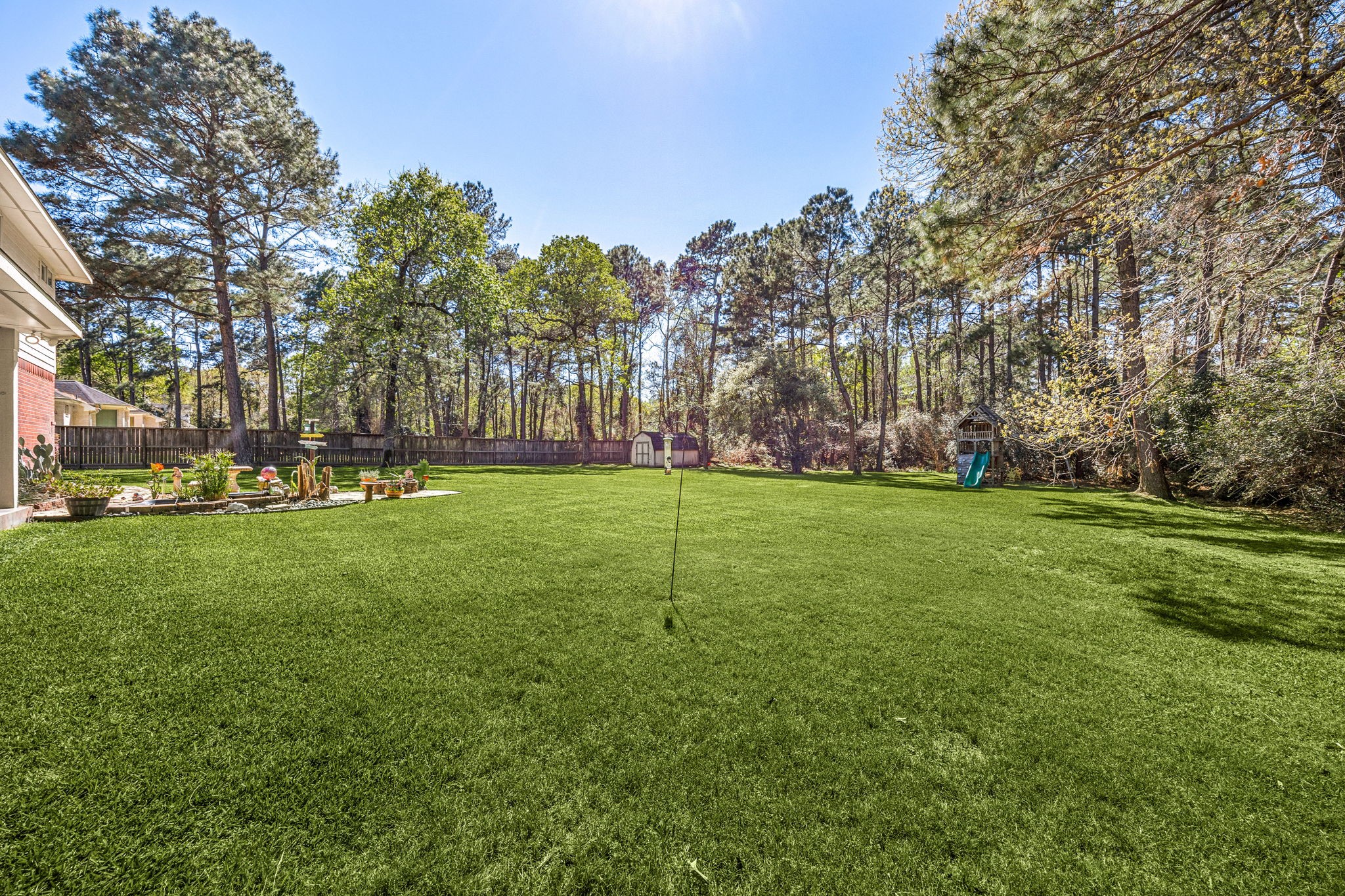 14419 Timbergreen Drive Magnolia, TX 77355 - Photo 34 of 43 Enjoy the expansive backyard with plenty of green space, mature trees, and room to relax, play, or entertain.