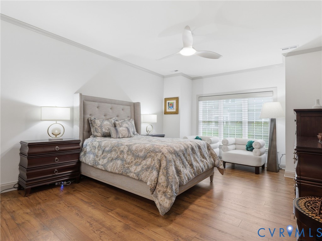 12520 Donahue Road Glen Allen, VA 23059 - Photo 16 of 35 a bedroom with a bed and a flat tv screen on dresser