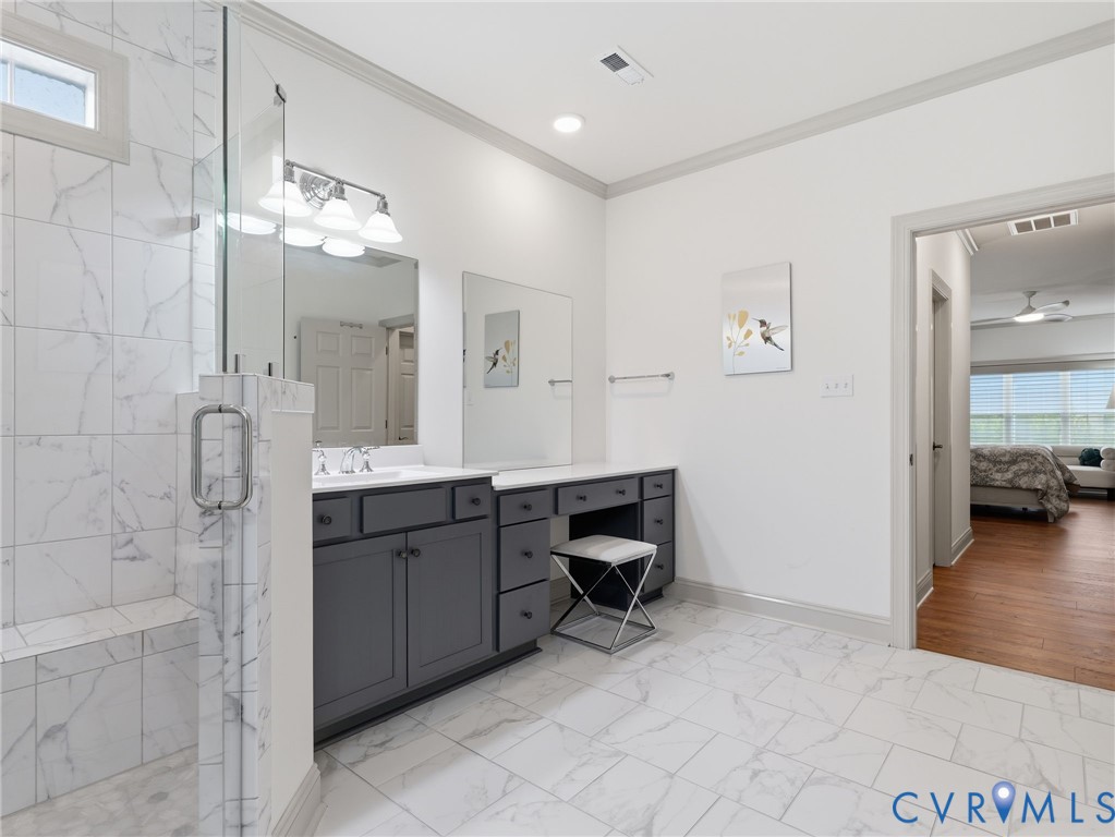 12520 Donahue Road Glen Allen, VA 23059 - Photo 17 of 35 a spacious bathroom with a double vanity sink a mirror and a shower