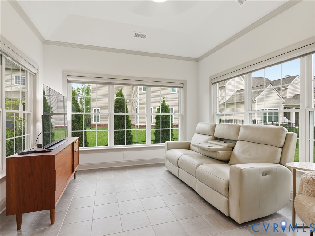 12520 Donahue Road Glen Allen, VA 23059 - Photo 20 of 35 a living room with furniture and large windows with garden view