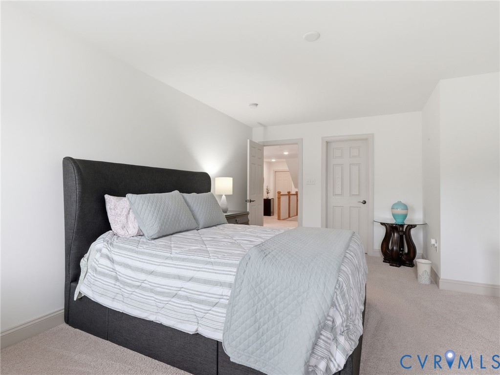 12520 Donahue Road Glen Allen, VA 23059 - Photo 27 of 35 a bedroom with a bed and a large mirror