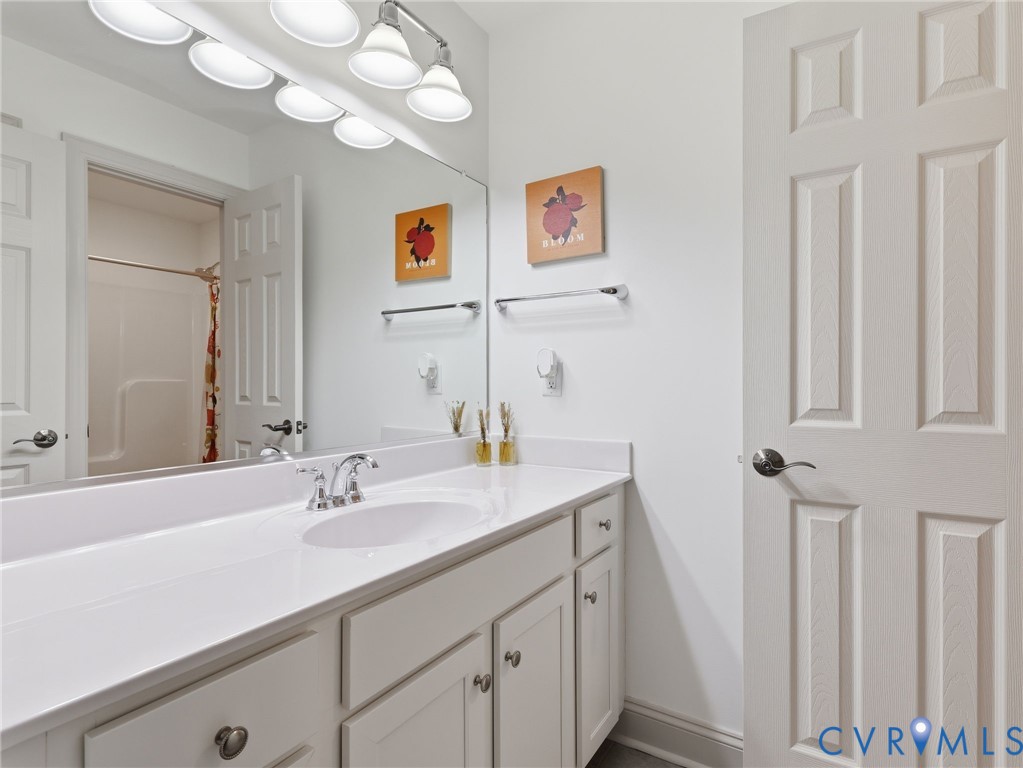 12520 Donahue Road Glen Allen, VA 23059 - Photo 28 of 35 a bathroom with a sink and a mirror