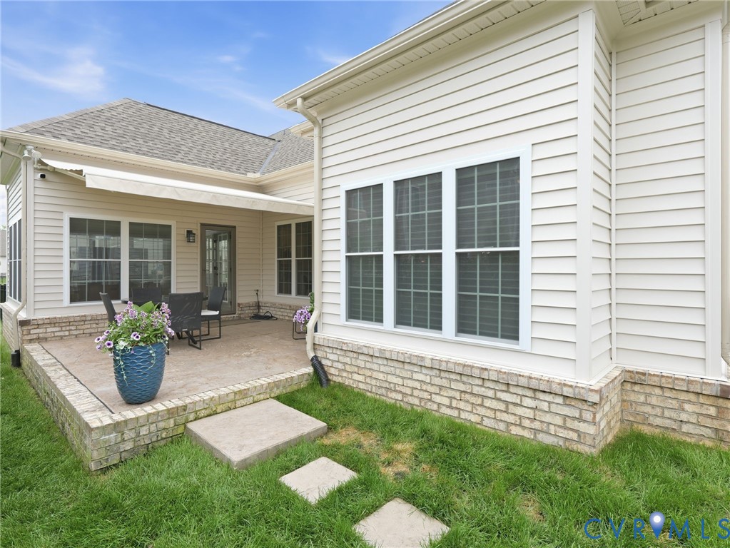 12520 Donahue Road Glen Allen, VA 23059 - Photo 34 of 35 a front view of a house with a garden and patio