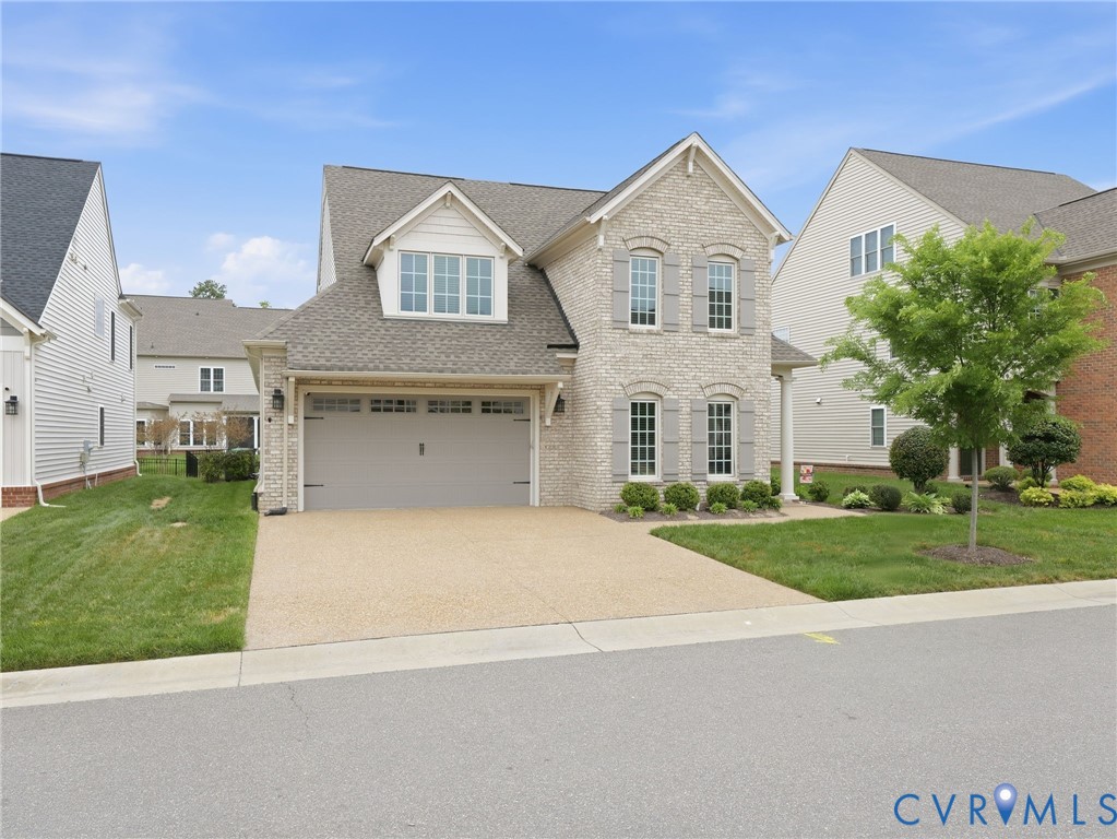 12520 Donahue Road Glen Allen, VA 23059 - Photo 35 of 35 a front view of a house with a yard and garage