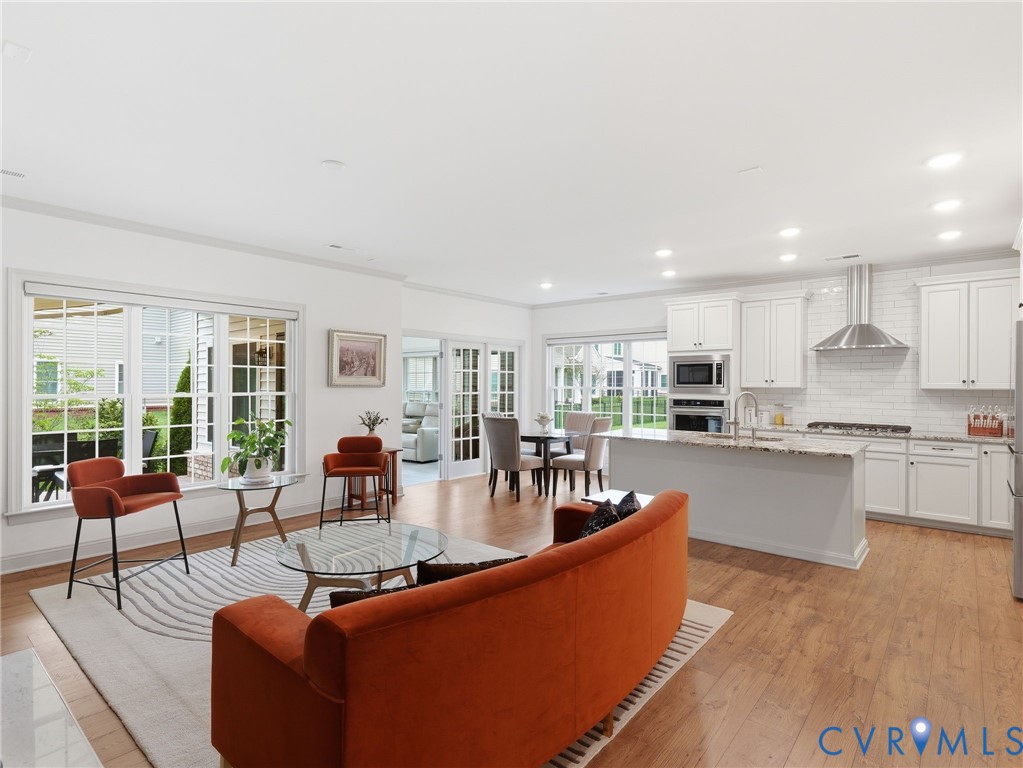 12520 Donahue Road Glen Allen, VA 23059 - Photo 10 of 35 a living room with kitchen island furniture and a kitchen view