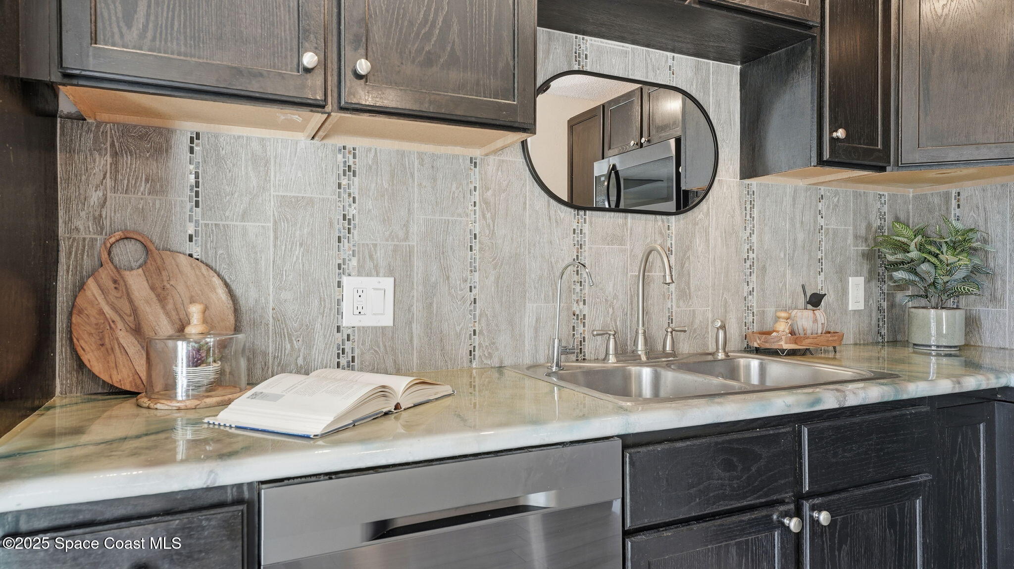 1511 Erin Court Palm Bay, FL 32905 - Photo 11 of 32 a bathroom with a granite countertop sink and a mirror