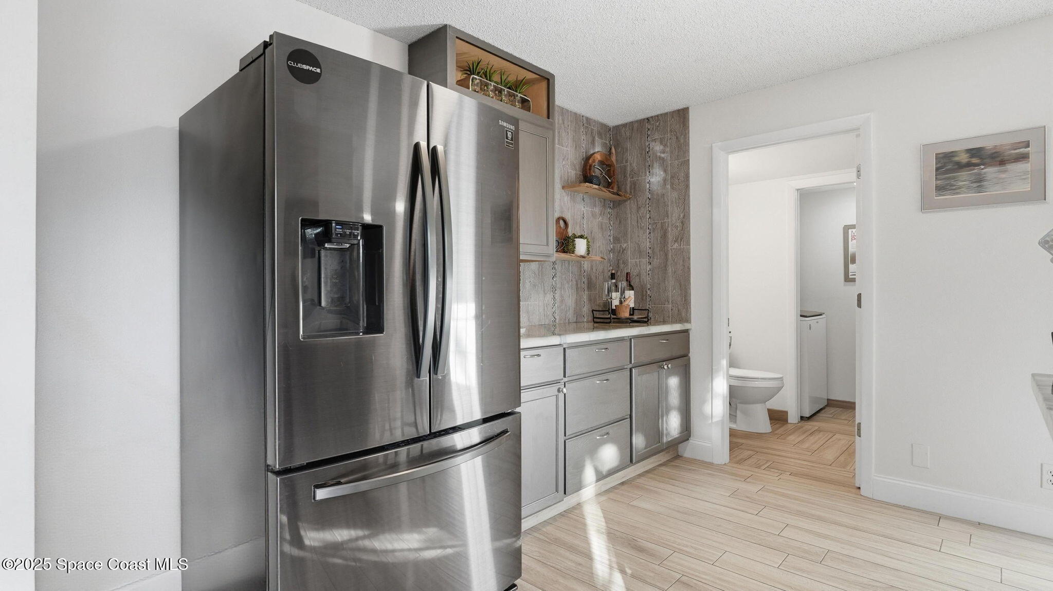 1511 Erin Court Palm Bay, FL 32905 - Photo 13 of 32 a kitchen with stainless steel appliances a refrigerator and a sink