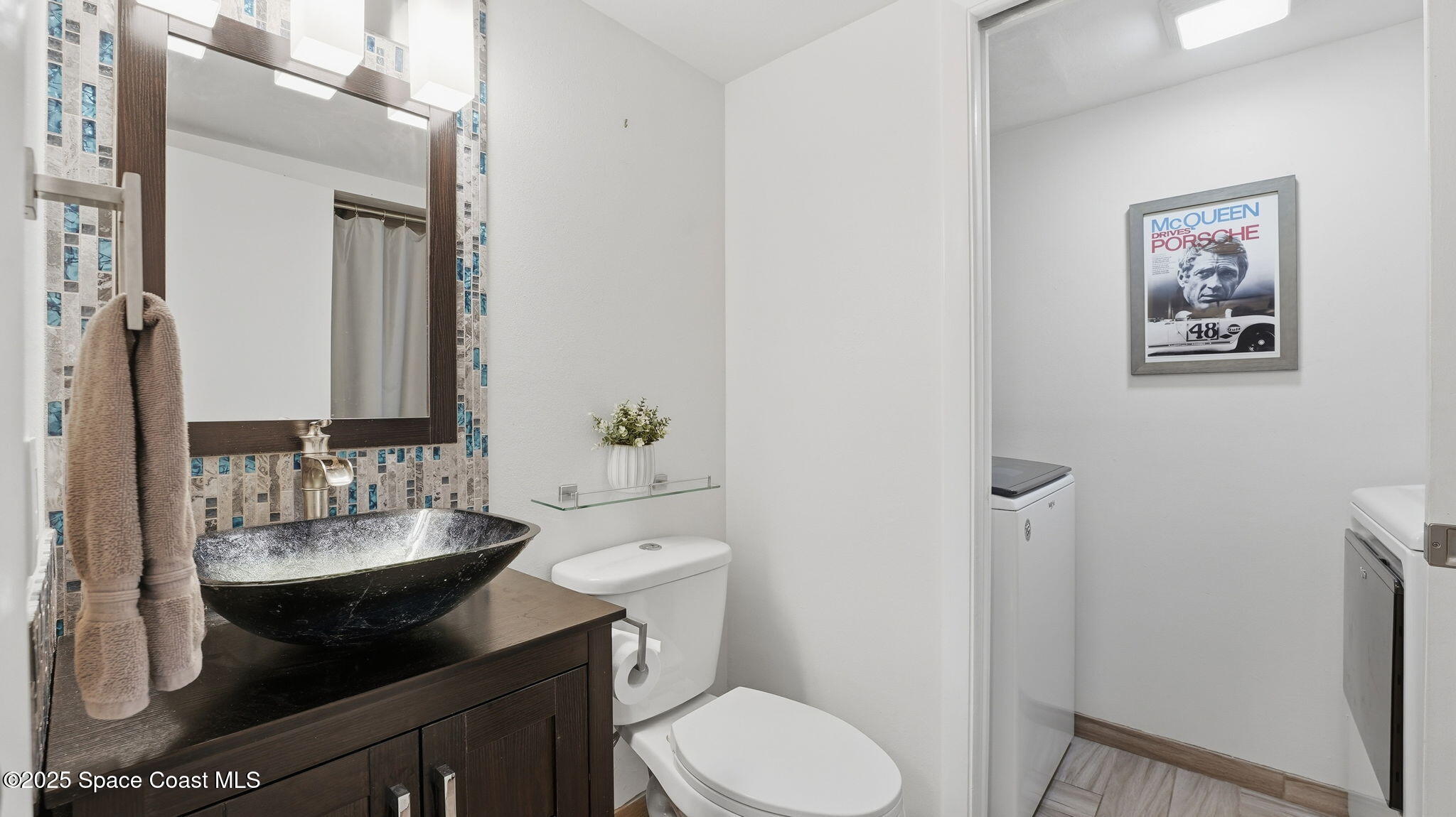 1511 Erin Court Palm Bay, FL 32905 - Photo 14 of 32 a bathroom with a sink toilet and mirror