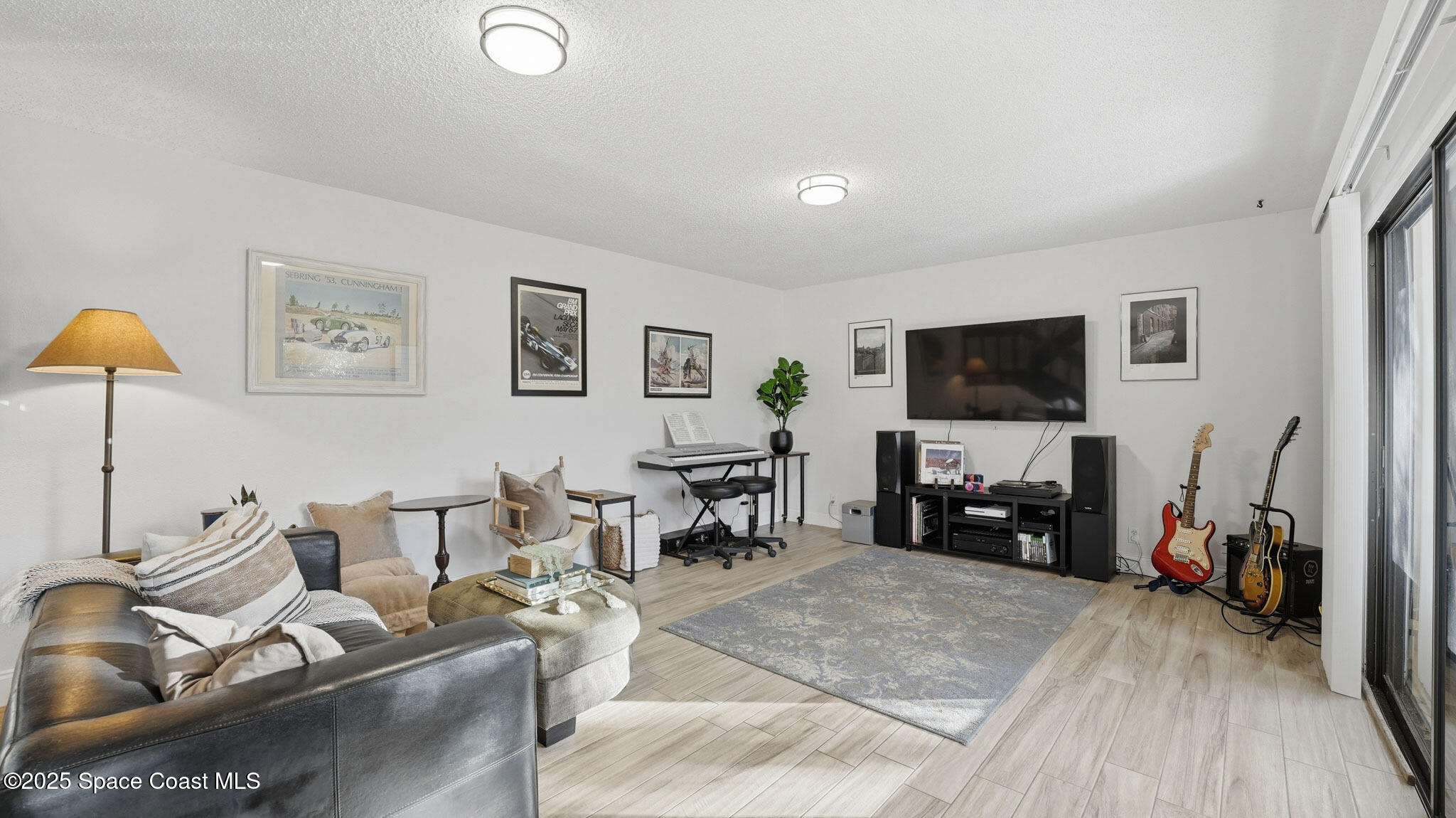 1511 Erin Court Palm Bay, FL 32905 - Photo 16 of 32 a living room with furniture and a flat screen tv
