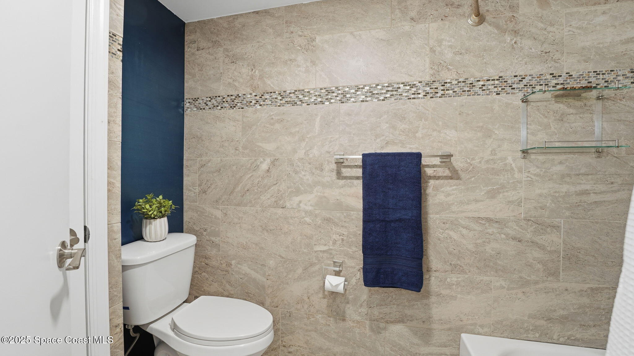 1511 Erin Court Palm Bay, FL 32905 - Photo 24 of 32 a bathroom with a toilet and a shower