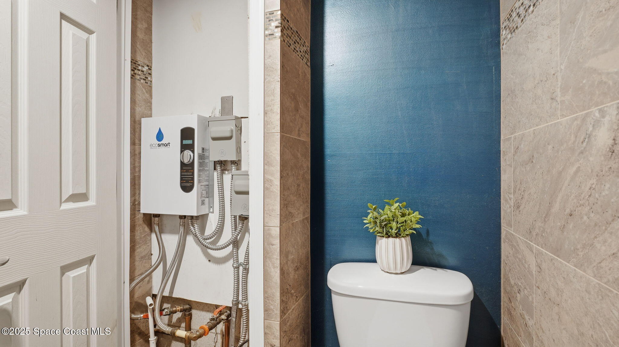 1511 Erin Court Palm Bay, FL 32905 - Photo 25 of 32 a bathroom with a toilet