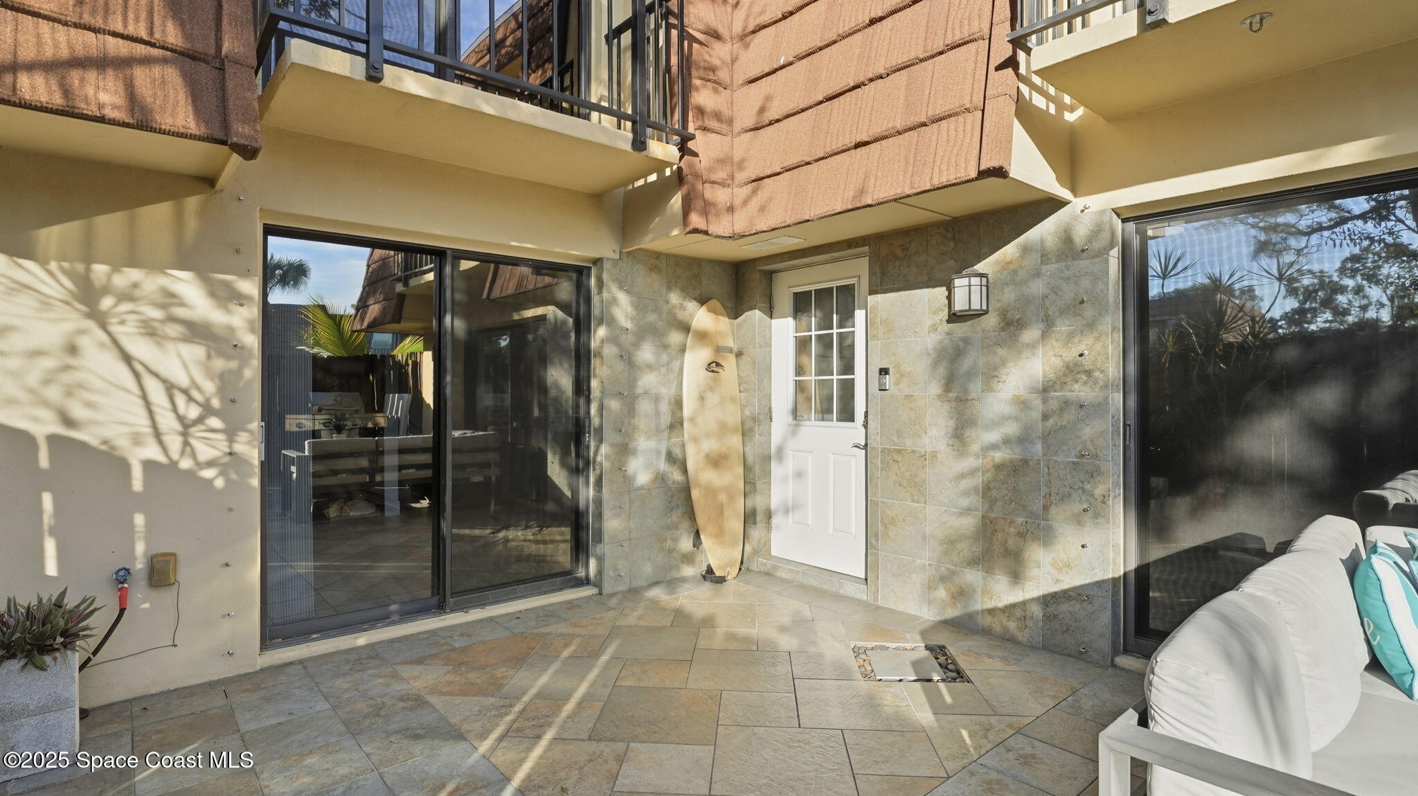 1511 Erin Court Palm Bay, FL 32905 - Photo 6 of 32 a view of a hallway with a glass door and glass door