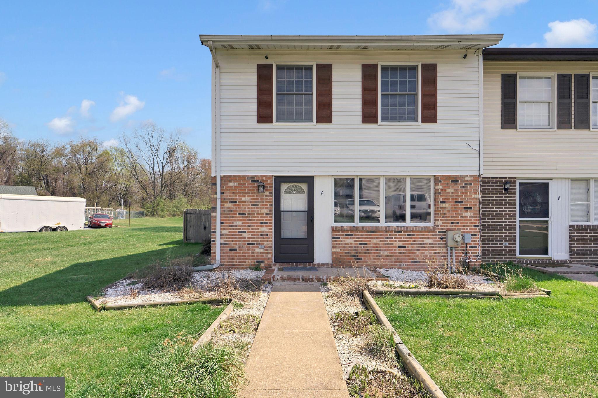 front view of a house with a yard