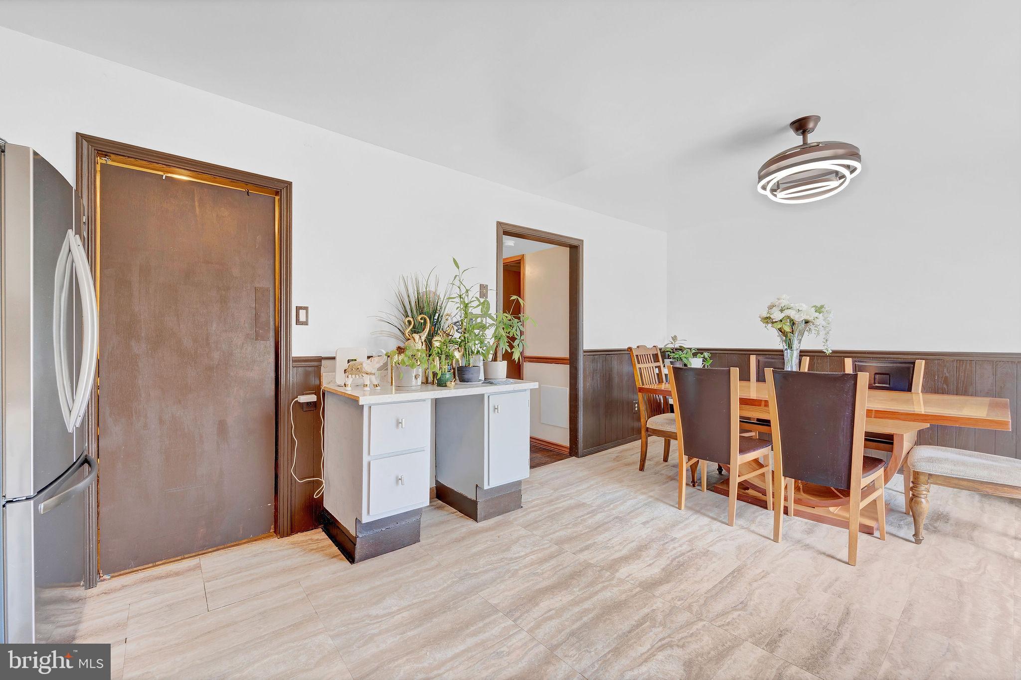 6 Transom Court Elkton, MD 21921 - Photo 11 of 33 a view of a dining room with furniture and a potted plant