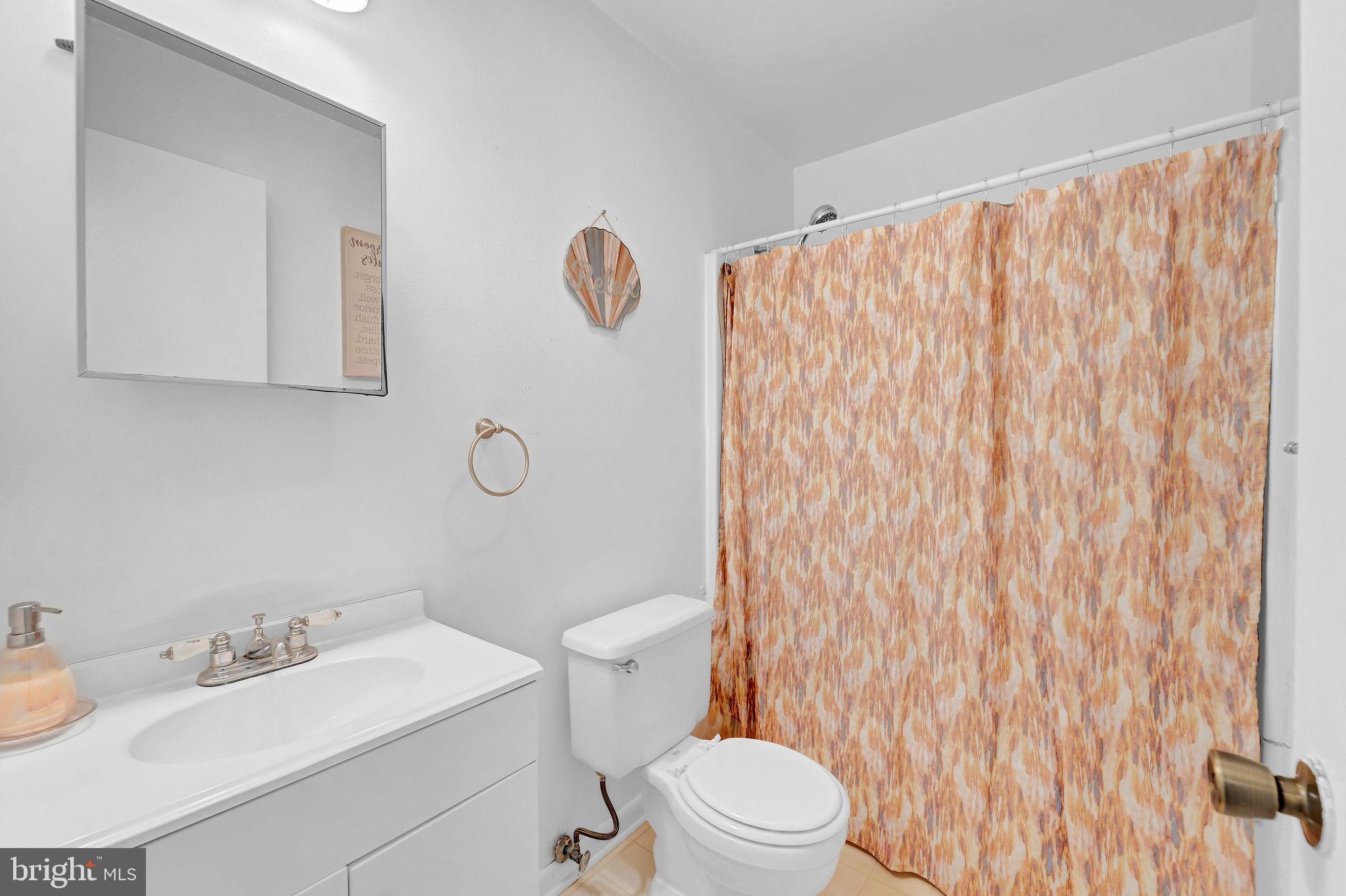 6 Transom Court Elkton, MD 21921 - Photo 17 of 33 a bathroom with a toilet sink vanity and mirror