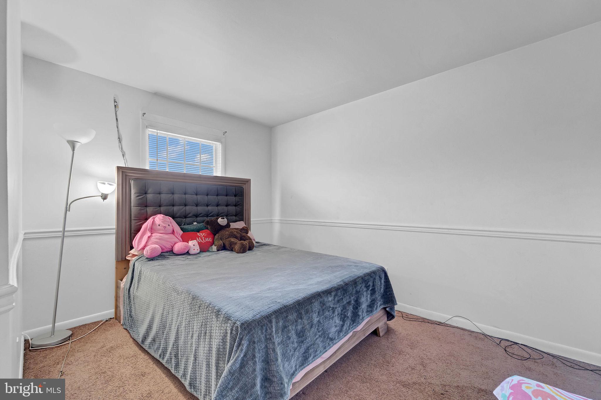 6 Transom Court Elkton, MD 21921 - Photo 21 of 33 a bedroom with a bed and a fireplace