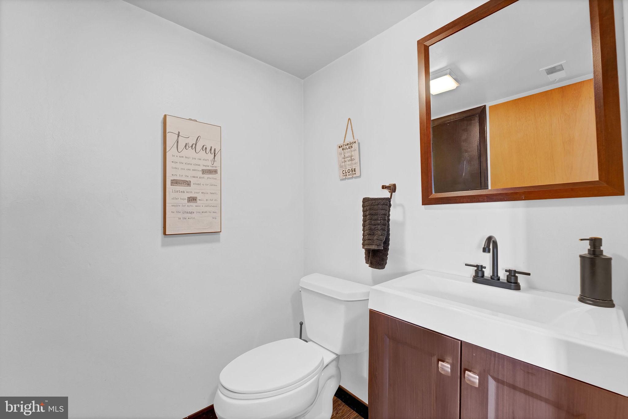 6 Transom Court Elkton, MD 21921 - Photo 9 of 33 a bathroom with a toilet a sink and mirror
