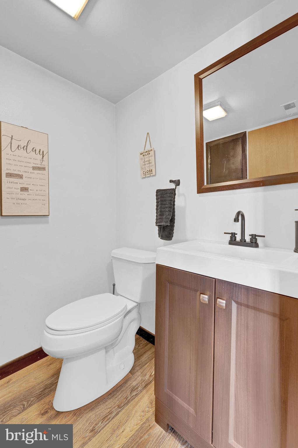 6 Transom Court Elkton, MD 21921 - Photo 10 of 33 a bathroom with a toilet a sink and mirror