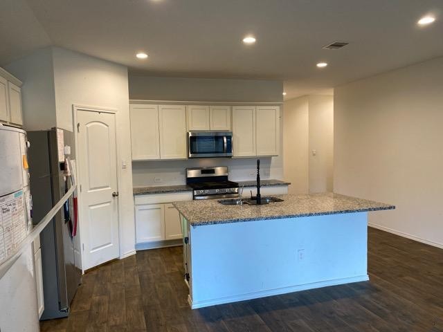 3510 Pearl Mill Lane Conroe, TX 77301 - Photo 8 of 17 a kitchen with granite countertop a refrigerator stove and sink