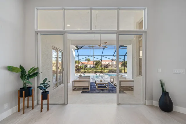 a spacious bedroom with a bed and a large window