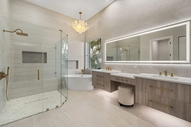 a bathroom with a granite countertop sink a toilet and shower