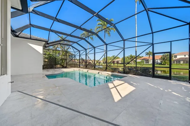 a front view of a house with a yard and a garage