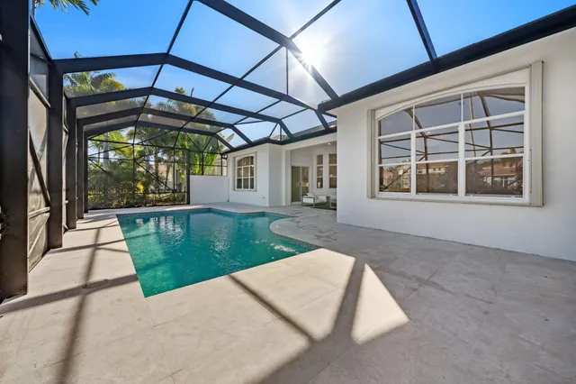 a view of a house with a garden and a yard