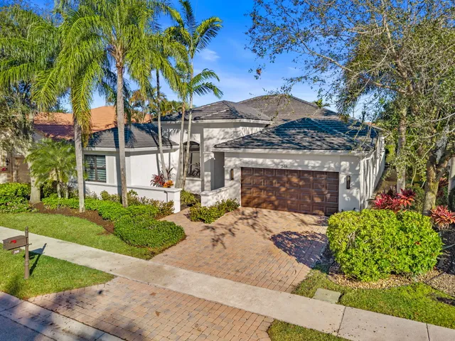 an aerial view of a house with a swimming pool