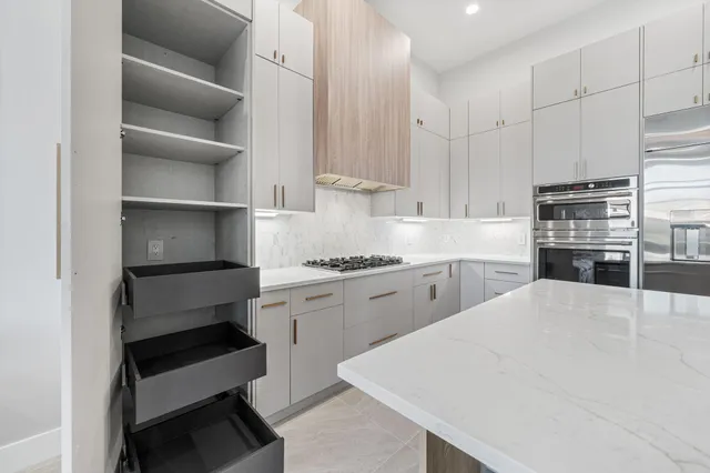a kitchen with a cabinets and appliances