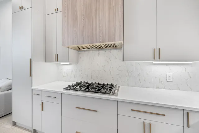 a kitchen with a sink and cabinets