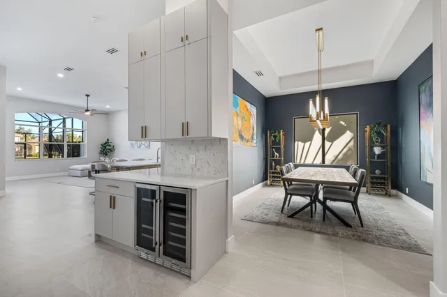 a kitchen with a stove a sink and a refrigerator