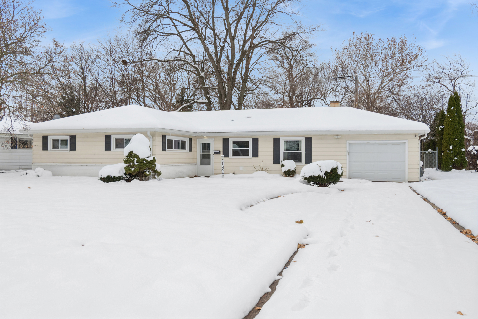 1902 North Washington Street Wheaton, IL 60187 - Photo 1 of 21 a view of house with yard outdoor seating and covered with trees