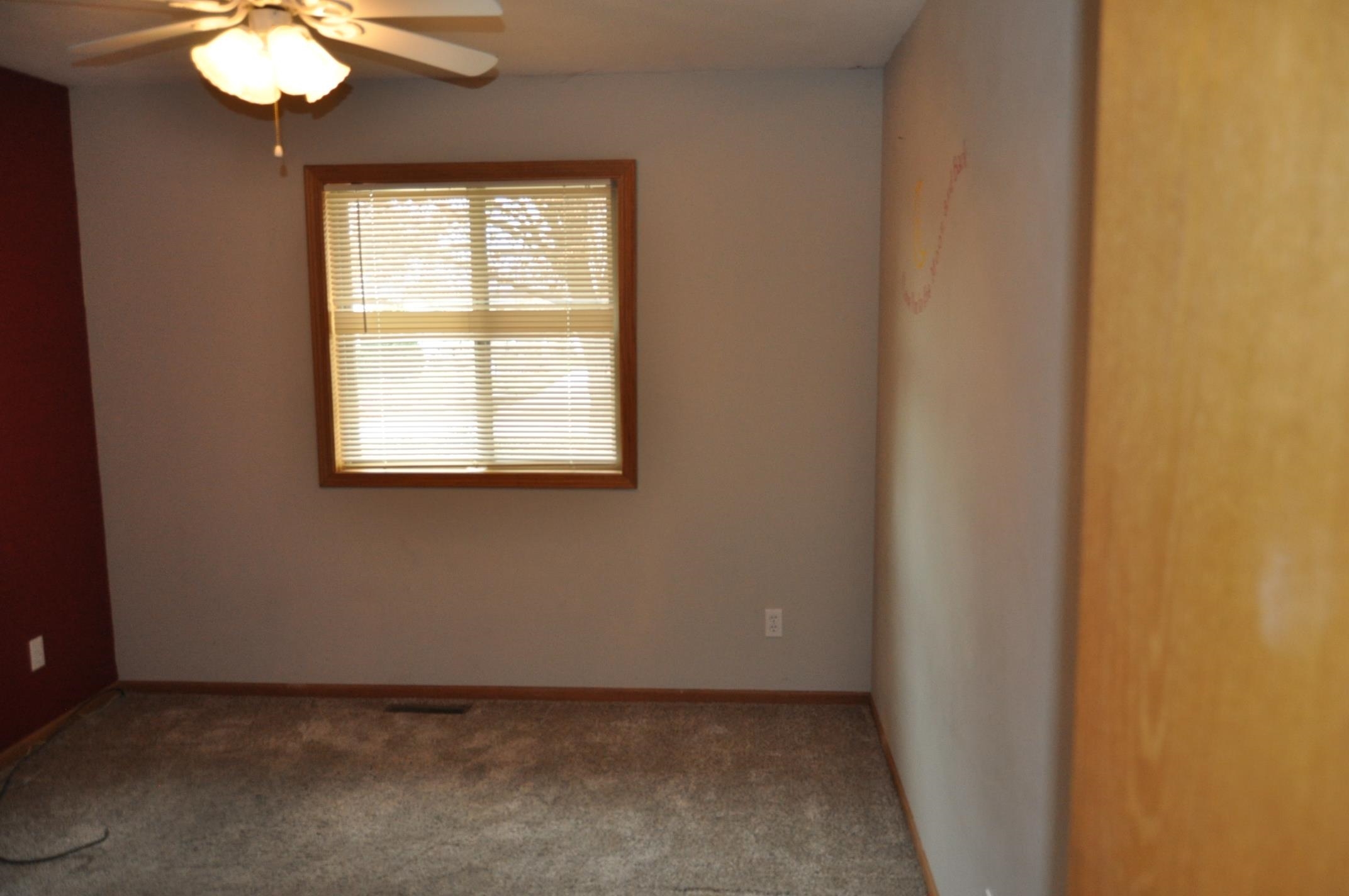 135 Fieldcrest Lane Cedarville, IL 61013 - Photo 15 of 45 an empty room with windows