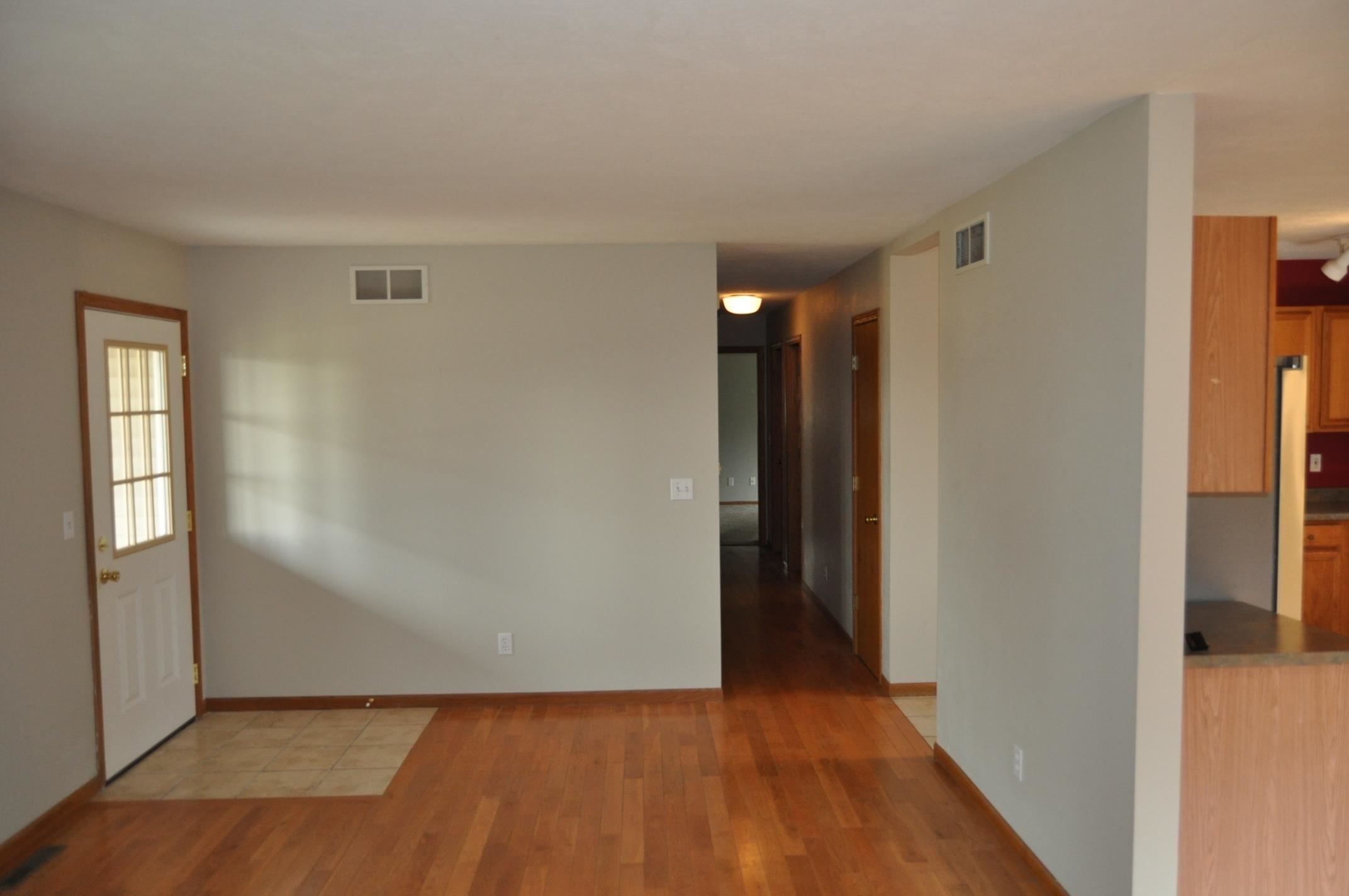 135 Fieldcrest Lane Cedarville, IL 61013 - Photo 2 of 45 a view of hallway with wooden floor