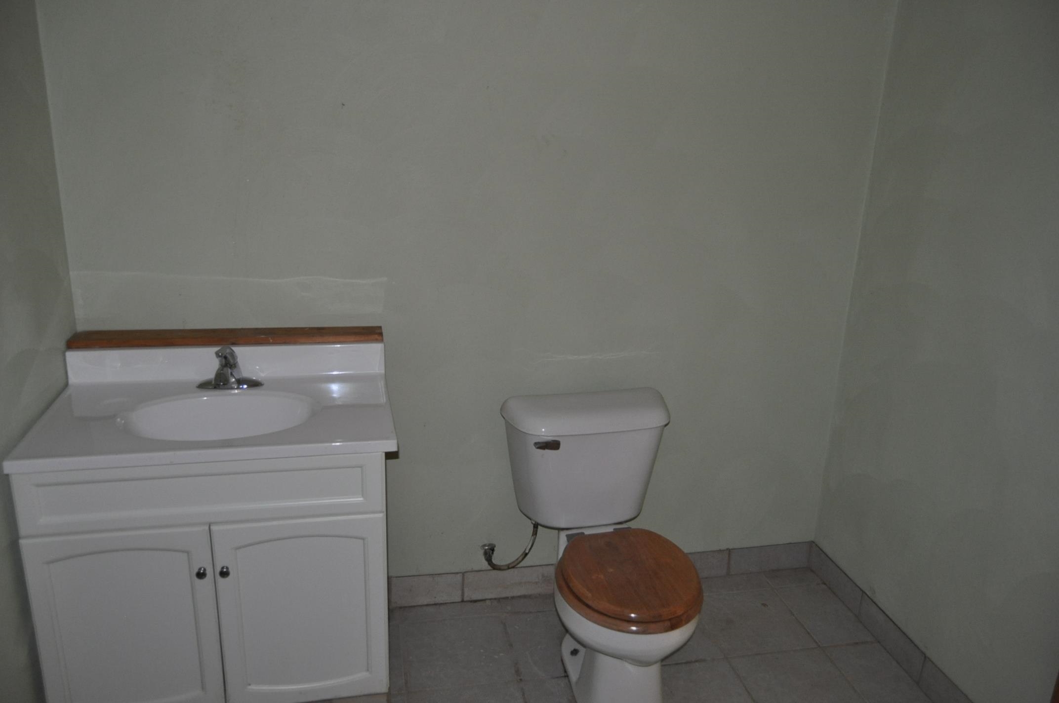 135 Fieldcrest Lane Cedarville, IL 61013 - Photo 29 of 45 a bathroom with a toilet sink and mirror