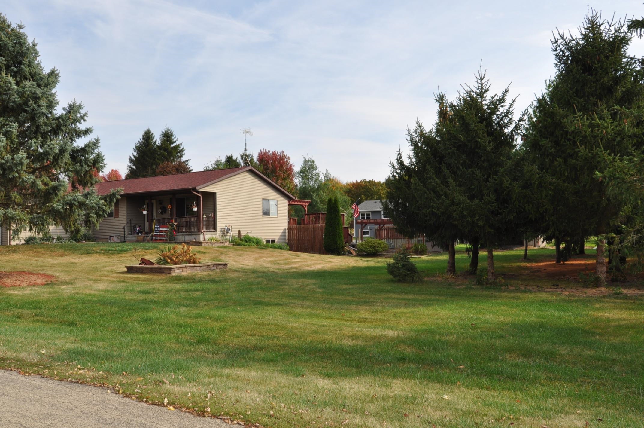 135 Fieldcrest Lane Cedarville, IL 61013 - Photo 35 of 45 a view of a house with a yard