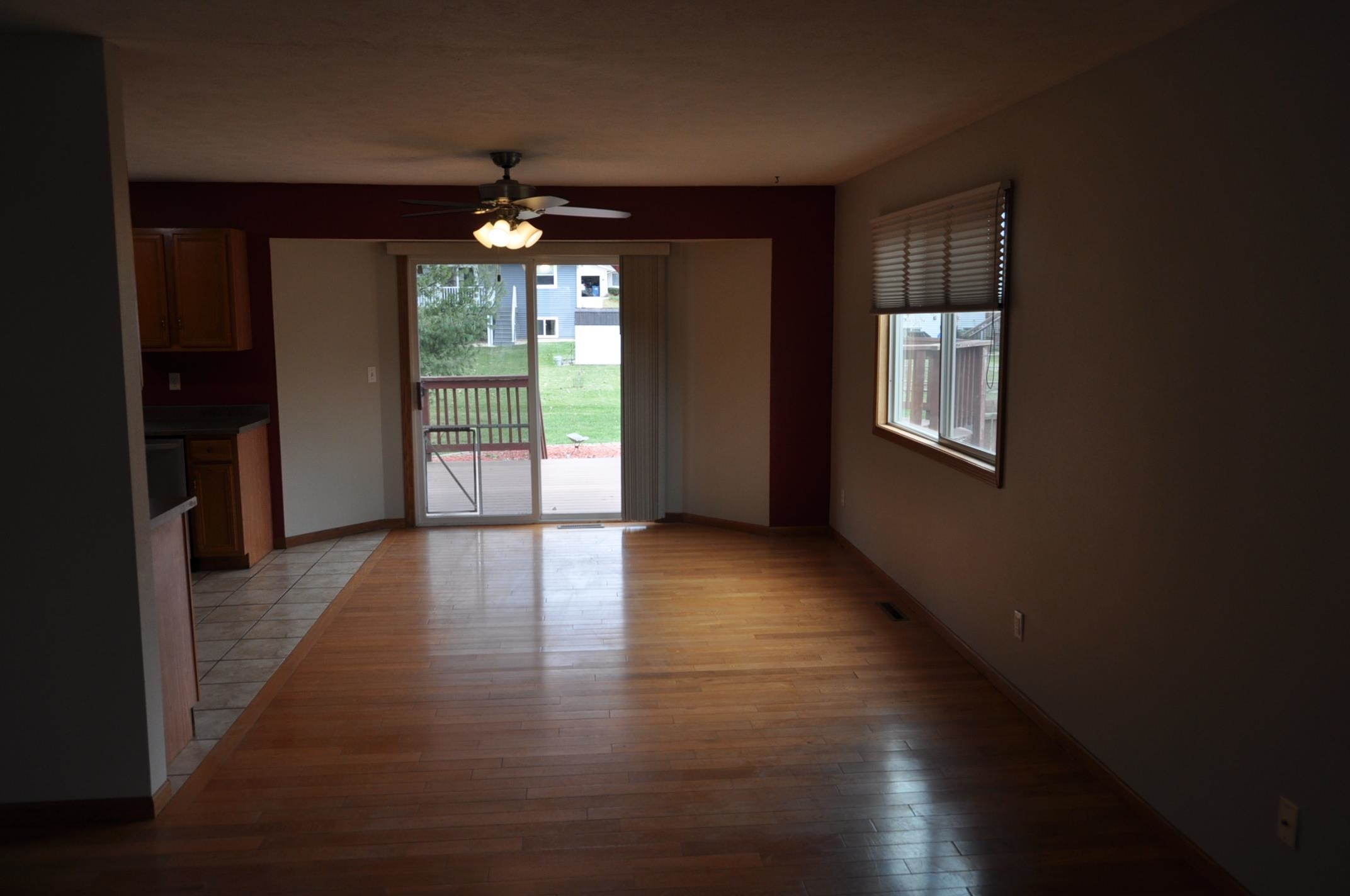 135 Fieldcrest Lane Cedarville, IL 61013 - Photo 7 of 45 a view of a room with wooden floor chandeliers and kitchen