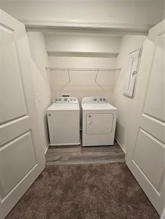 an empty room with a ceiling fan and carpet
