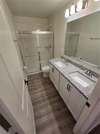 a view of a big room with closet and windows