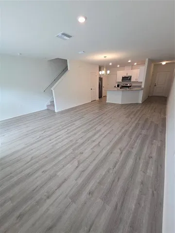 a view of a kitchen with a sink and a microwave