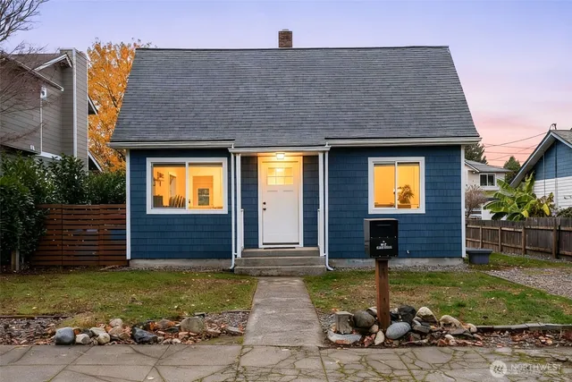 a front view of a house with garden