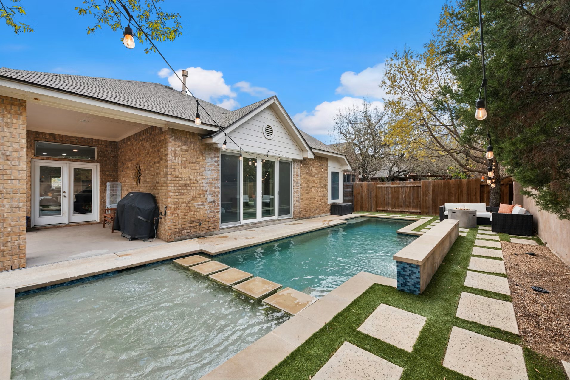 320 El Socorro Lane Austin, TX 78732 - Photo 17 of 40 a view of a house with backyard and sitting area